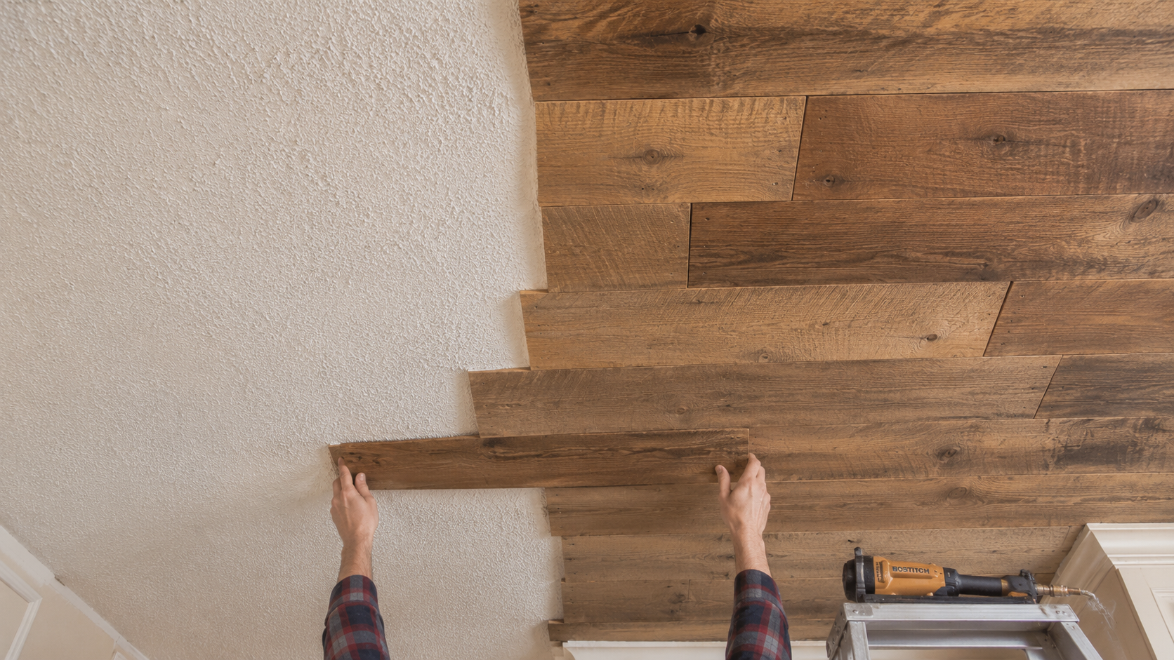 Installing reclaimed wood planks directly over an existing popcorn ceiling