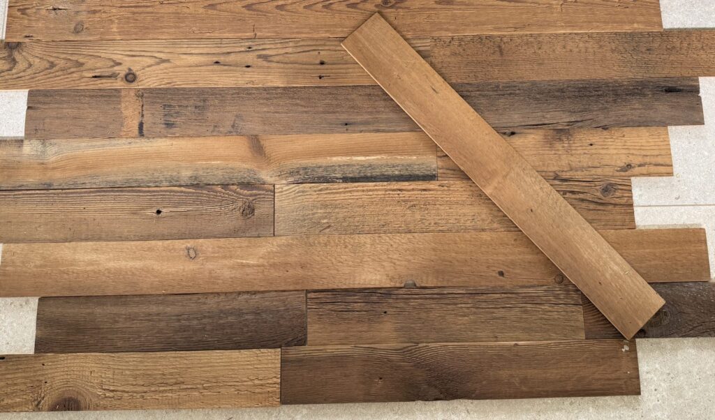 Genuinely weathered brown reclaimed barn wood planks up close