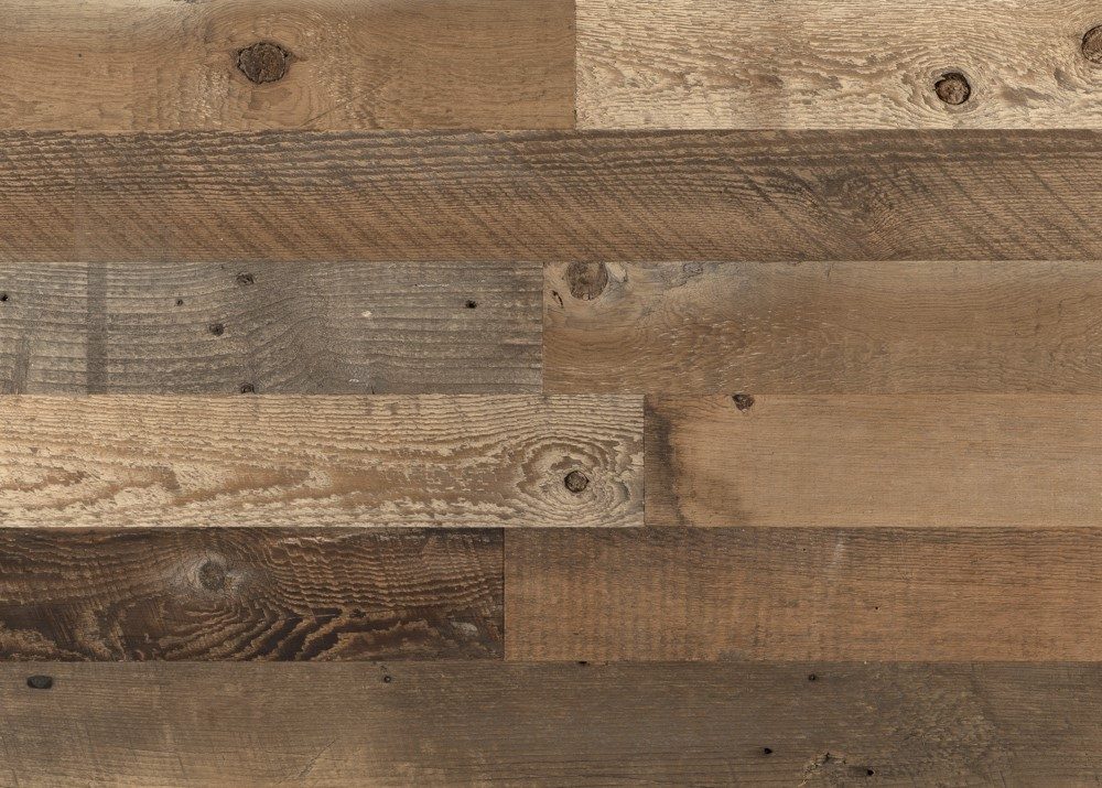 Close-up of 3.5 inch brown reclaimed barn wood planks showing mixed tones and grain