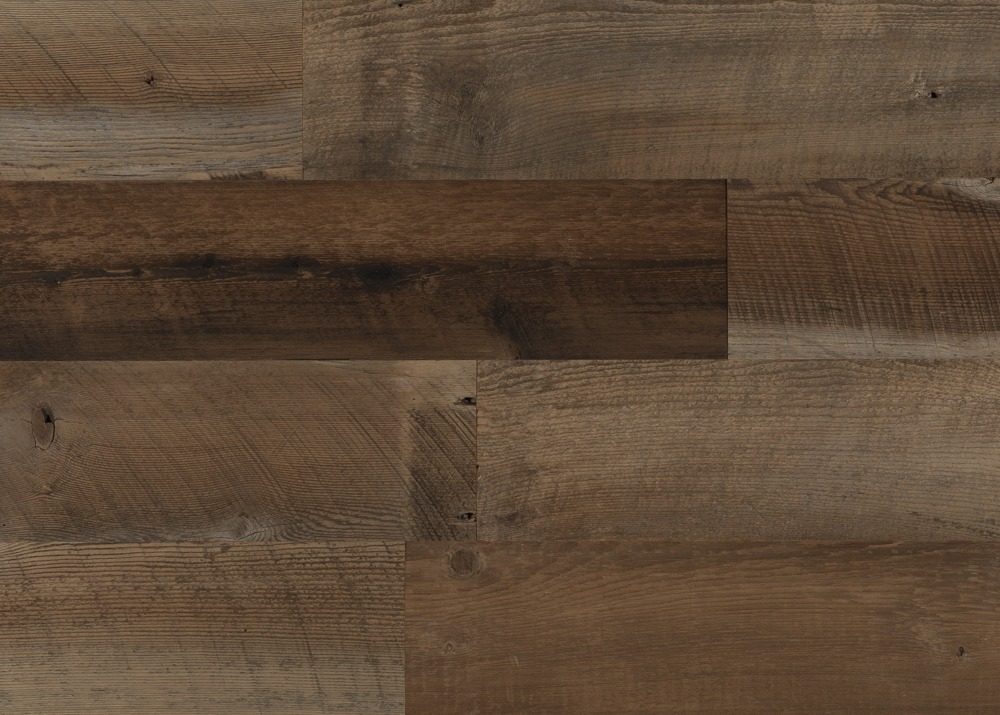 Close-up of weathered brown reclaimed barn wood grain with nail holes